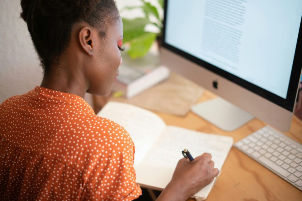 https://www.pexels.com/photo/woman-writing-on-her-notebook-3059747/