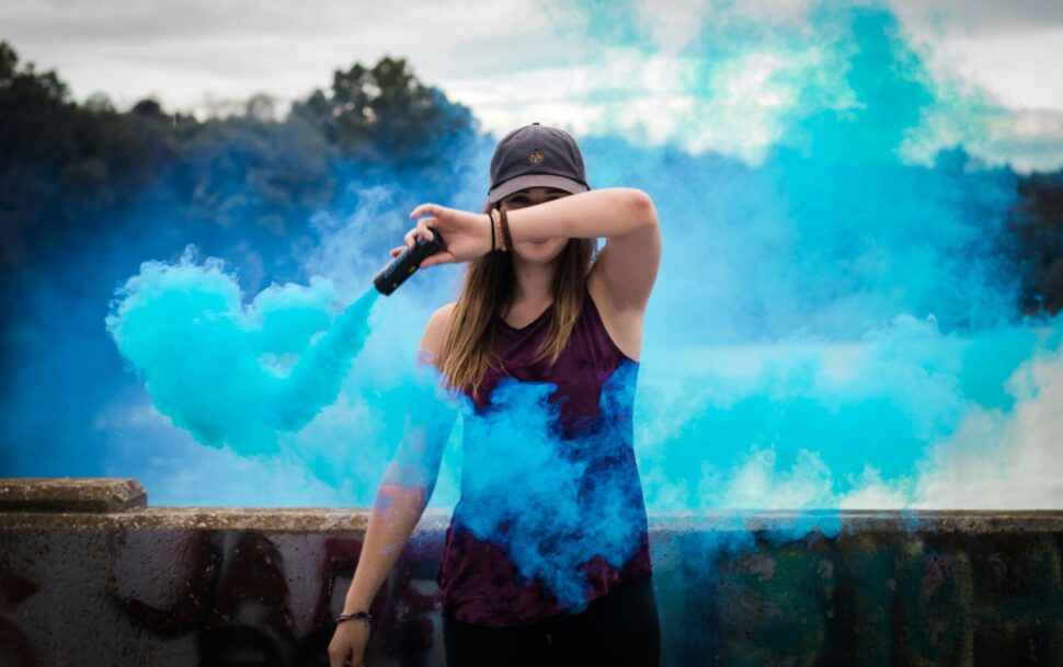 https://www.pexels.com/photo/woman-holding-blue-smoke-flare-445109/