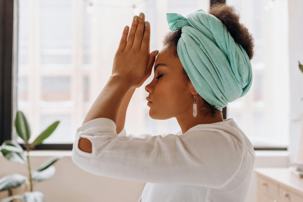 https://www.pexels.com/photo/woman-in-white-long-sleeve-shirt-with-blue-towel-on-head-6932075/