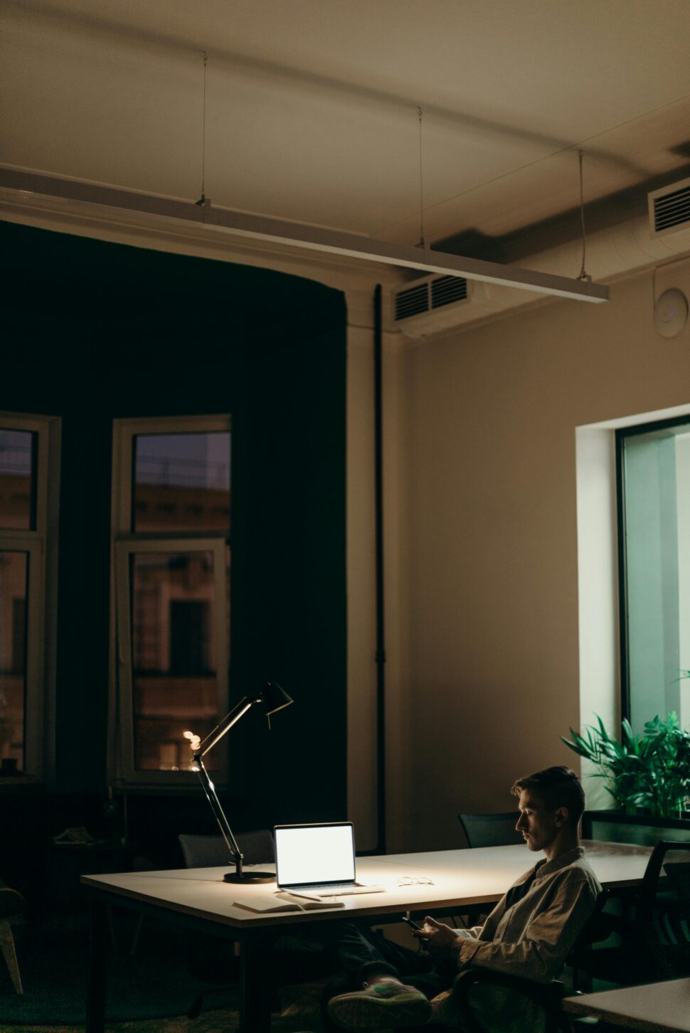 https://www.pexels.com/photo/man-in-black-jacket-sitting-on-chair-4069290/
