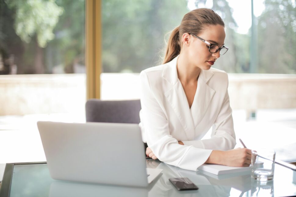 https://www.pexels.com/photo/thoughtful-businesswoman-taking-notes-in-notebook-in-bright-office-3756693/