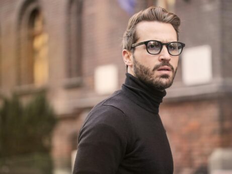 https://www.pexels.com/photo/man-standing-near-building-white-black-turtleneck-shirt-874158/