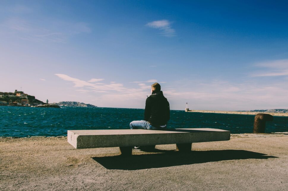 https://www.pexels.com/photo/person-wearing-blue-jeans-sitting-on-bench-1074535/