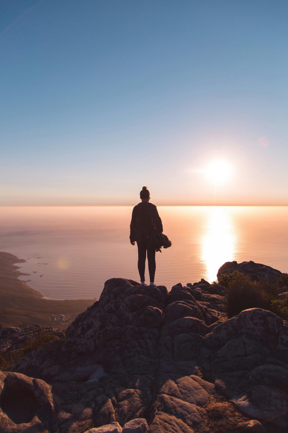 https://www.pexels.com/photo/person-standing-on-brown-rock-formation-2342547/
