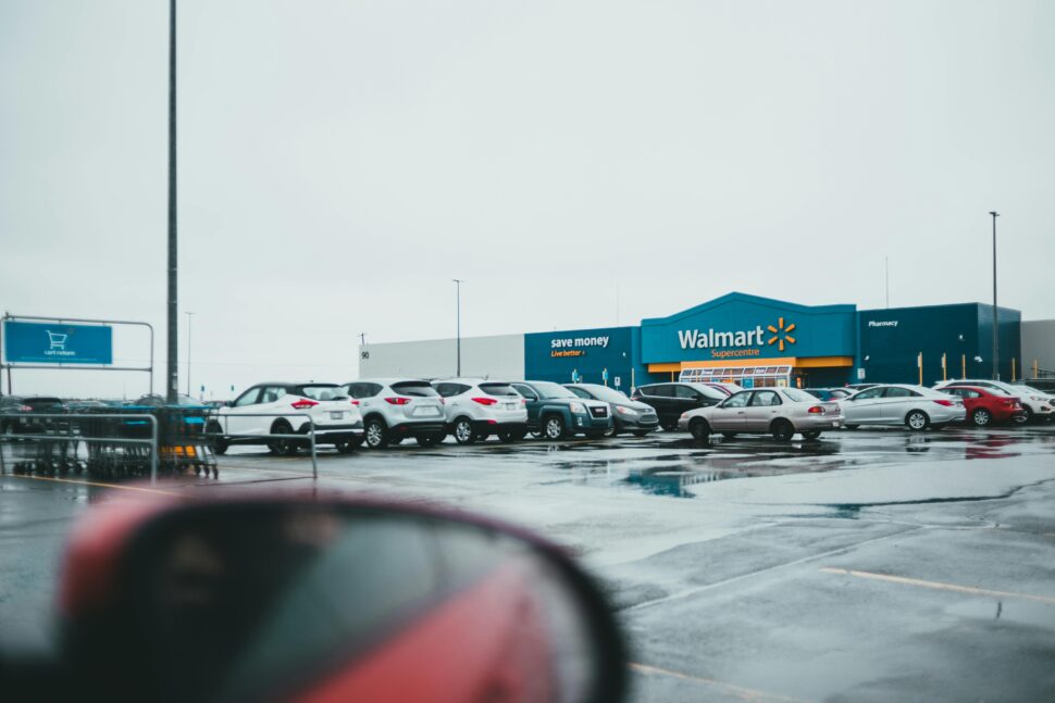 https://www.pexels.com/photo/car-parked-in-parking-lot-near-shop-7196438/