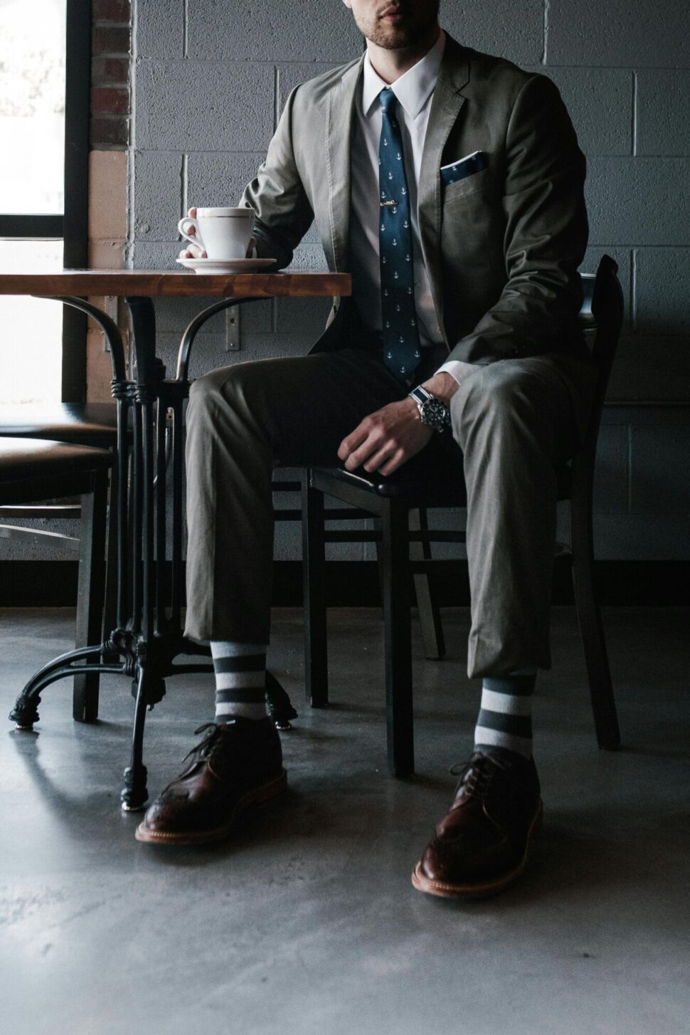 https://www.pexels.com/photo/photo-of-man-sitting-on-chair-3178767/