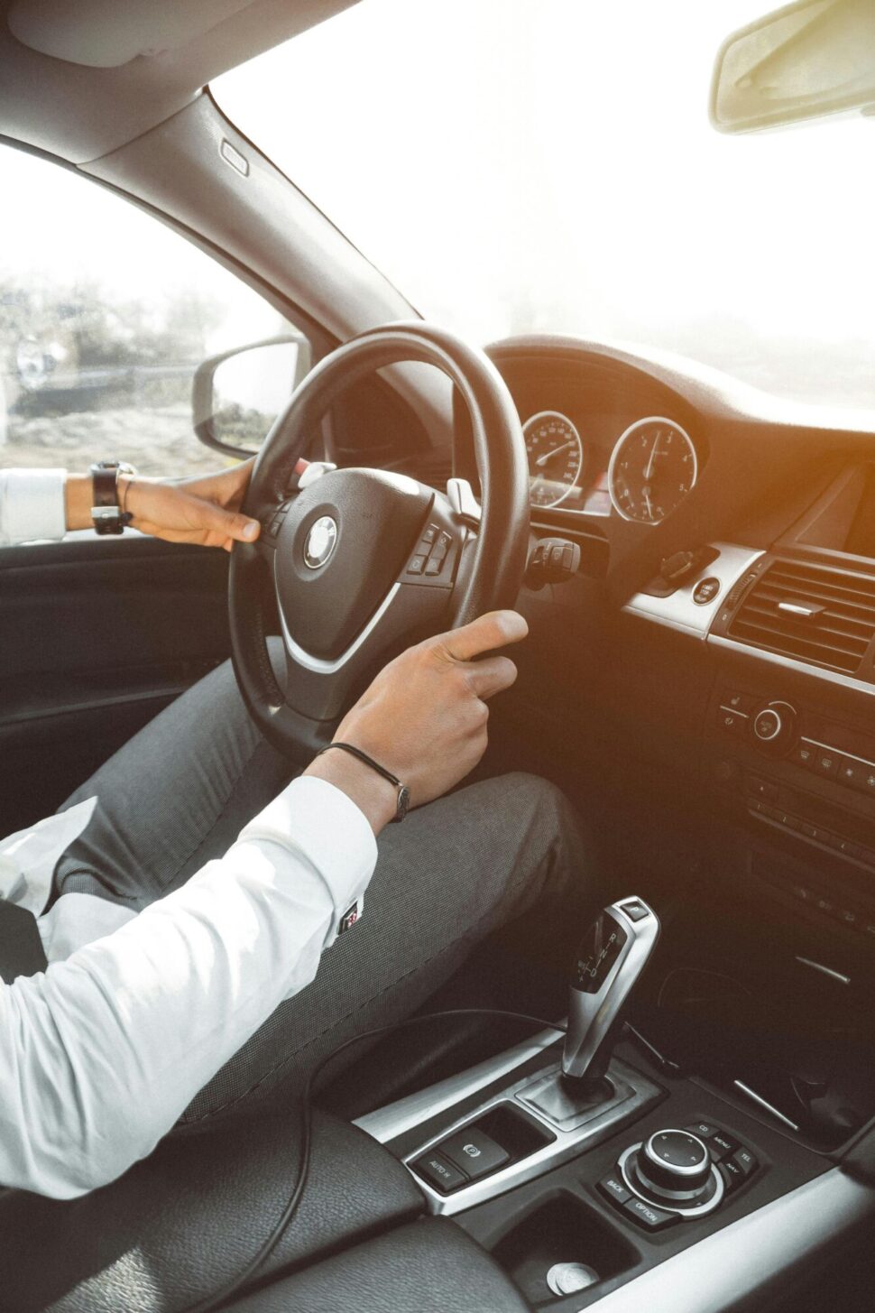 https://www.pexels.com/photo/person-drives-a-luxurious-car-804130/