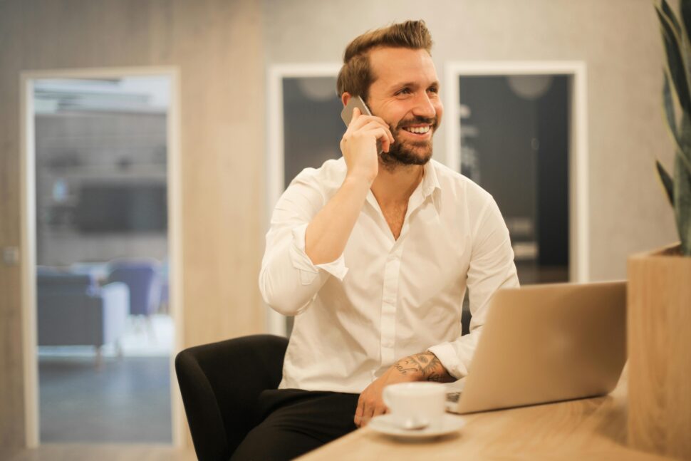 https://www.pexels.com/photo/smiling-formal-male-with-laptop-chatting-via-phone-3760263/