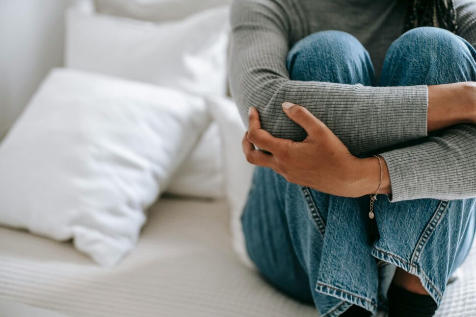 https://www.pexels.com/photo/woman-in-desperate-and-anxiety-sitting-alone-5699860/