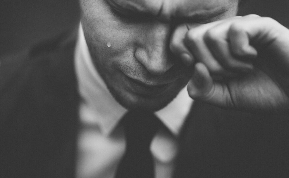 https://unsplash.com/photos/man-wiping-his-tears-T5lmpSYxnSU
