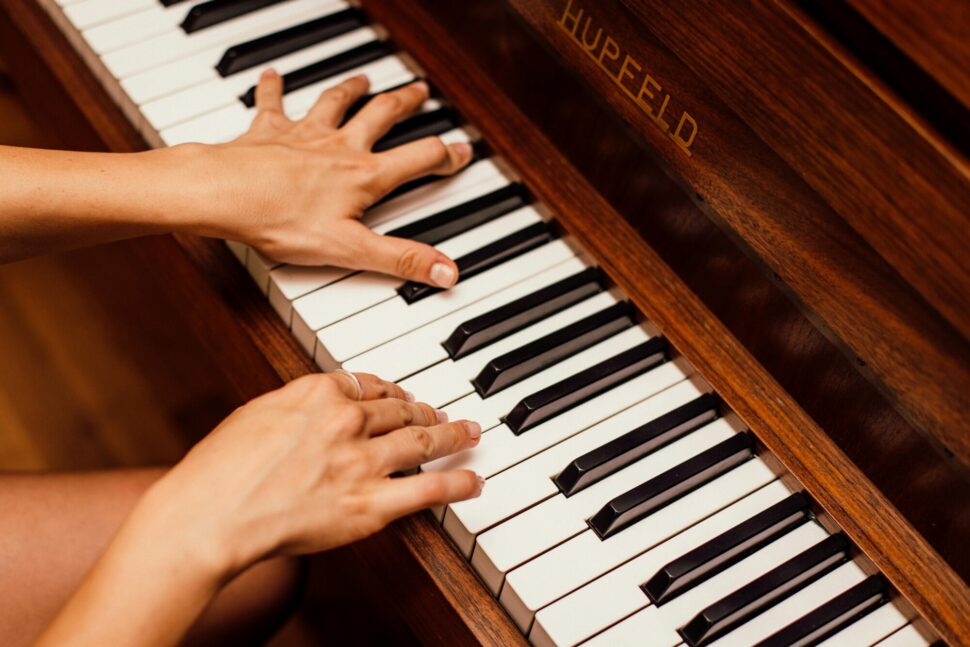 https://www.pexels.com/photo/close-up-photo-of-person-playing-piano-1246437/
