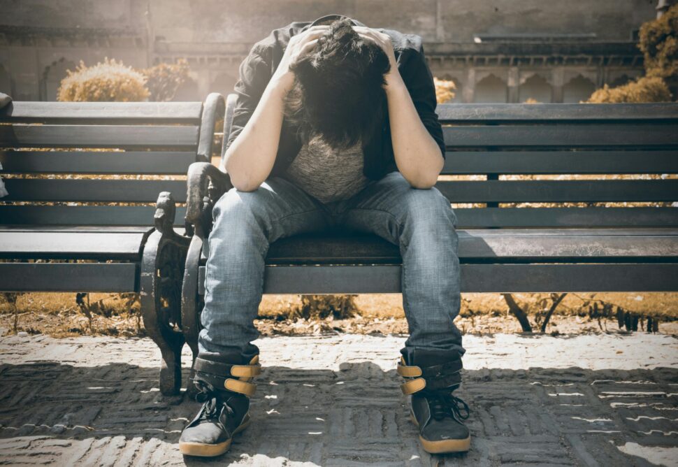 https://www.pexels.com/photo/man-in-black-shirt-and-gray-denim-pants-sitting-on-gray-padded-bench-1134204/
