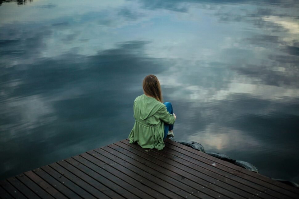 https://www.pexels.com/photo/woman-sitting-on-wooden-planks-2865901/