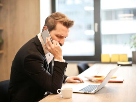 https://www.pexels.com/photo/man-having-a-phone-call-in-front-of-a-laptop-859264/