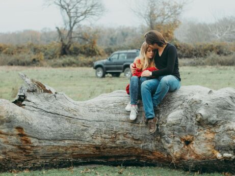 https://www.pexels.com/photo/mother-and-daughter-sitting-on-tree-log-840566/